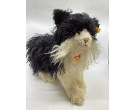     Steiff large Possy Norwegian standing cat c 13” x 20” as a guide with chest card tag and label and yellow button tag-shag