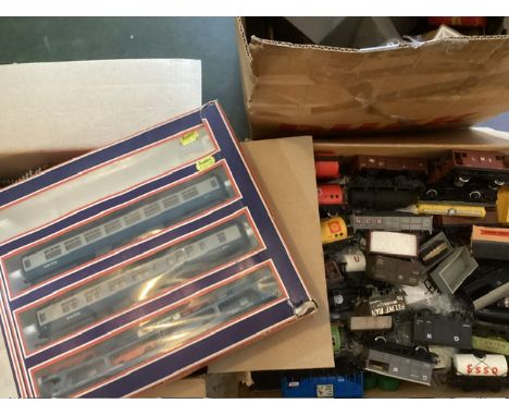 Model Railway interest to include; a large box of OO garage wagons and tanks , track, chassis for Locos and 3 Lima boxed carr