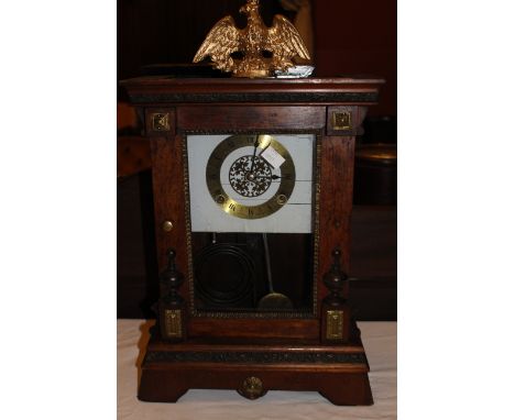 19th century chiming mantel clock with eagle top and copper plate detail to case, pendulum included but clock face and pendul