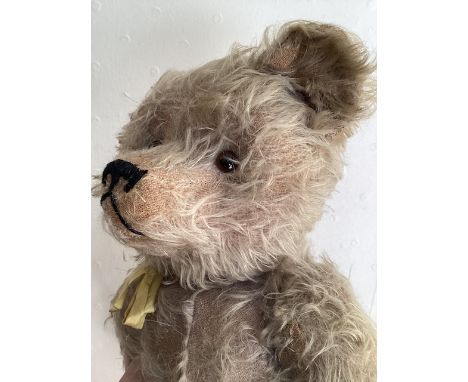   Antique early 20th WW1 era Teddy bear ;Likely J K Farnell, with a hump back construction- Originally Lavender in shade and 