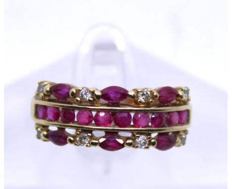 9ct Yellow Gold Ruby & Diamond Dress ring.  The ring is hallmarked '375' for 9ct Gold.  The ring has ten Round Brilliant Cut 