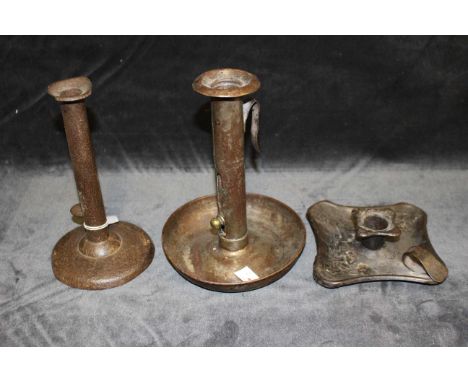An 18th/19th iron&nbsp; "hogscraper" ejector candlestick on circular base, 15cm high, a tinplate example&nbsp; with dished ba