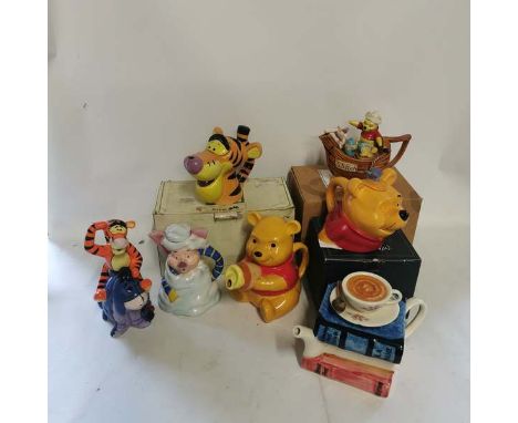 A collection of collectable teapots relating to Winnie The Pooh to include; A Cardew Design Disney Showcase collection Teapot