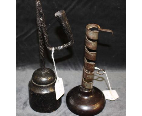 An 18th/19th century iron "rat de cave" spiral candlestick, with ejector, on turned wood base, 19cm high and an 18th century 