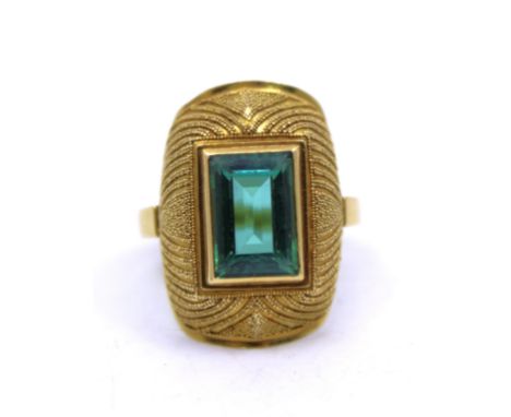 Green Tourmaline ring(No hallmark but tests as 22ct gold-the setting of the ring).A domed and beaded setting is adorned with 