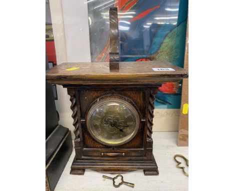 An Oak bracket clock and bracket