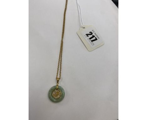 A 9ct gold chain and a jade pendant