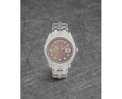 Rolex. An extremely fine and rare platinum automatic diamond set calendar bracelet watch with mother of pearl dialModel: Day-