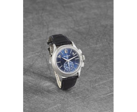 Patek Philippe. A fine and rare platinum automatic annual calendar flyback chronograph wristwatch with day/night indicationRe