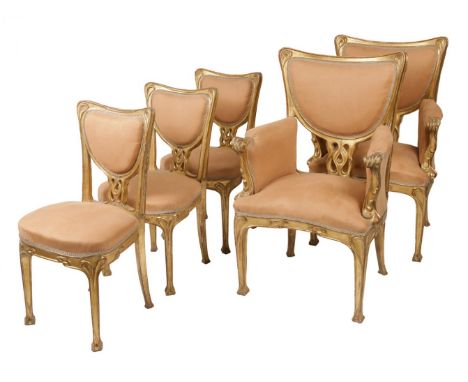 GEORGES DE FEURE (Paris, 1868 - 1943).Set of two Art Nouveau armchairs and three chairs, ca. 1900.Carved and gilded wood.Meas