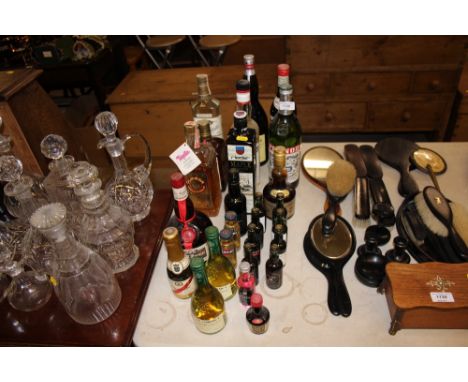 Two bottles of Tequila, a bottle of Cointreau, Martini, various miniatures etc.