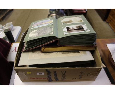 A post-card album and photo album; together a quantity of loose photographs