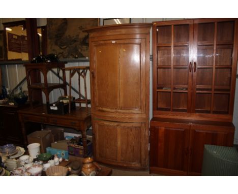 A Victorian pine bow front corner cupboard 