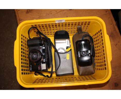 A Samsung, Minolta and Olympus camera