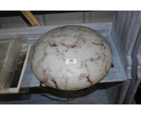 A mottled glass light shade