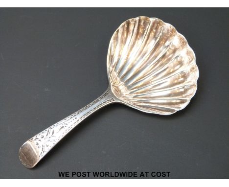 A Georgian hallmarked silver caddy spoon with scallop shaped bowl and bright cut handle, Ldn 1792 maker Duncan Urquhart & Nap