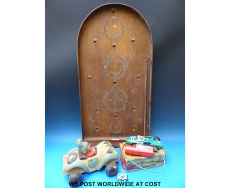 A boxed remote controlled Vanwall racing car c1960s, together with a foam Noddy in his car and a Jaques Hit-a-Pin bagatelle