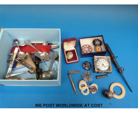 A collection of hallmarked silver items including a baby's rattle, hallmarked baby brooch, cutlery, vintage pen, filligree je