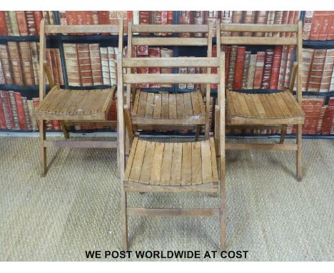 Four vintage wooden folding chairs