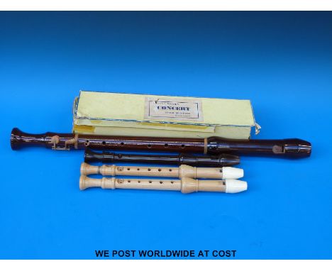 Three descant recorders by Schott, two in maple and a bakelite, together with a Schott's wooden tenor recorder in original bo