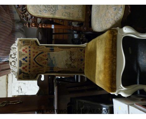 A carved Prie Dieu chair with tapestry book