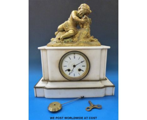 A 19thC figural alabaster ormolu mounted mantel clock, white enamel dial, Roman numerals, Brequet style hands, the finial bei
