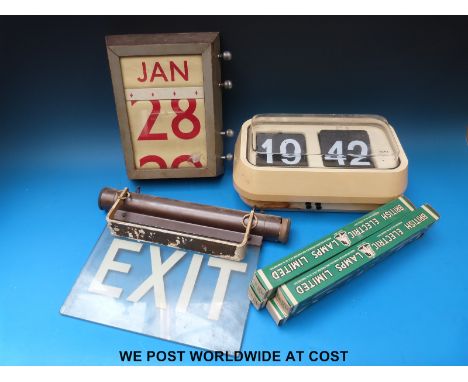 A vintage 'Exit' sign with illumination feature together with four spare bulbs, a vintage perpetual calendar c1920 and 1970's