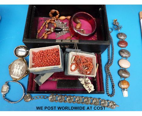 A vintage jewellery box, mourning brooch, agate bracelet, coral beads, marcasite watch etc 