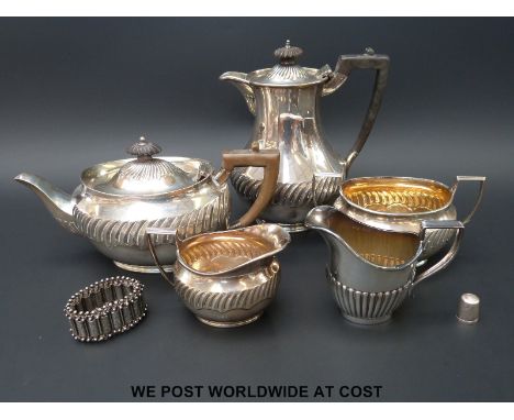 A four piece hallmarked silver tea set, various hallmarks but similar design, (weight 1120g all in) together with a plated cr