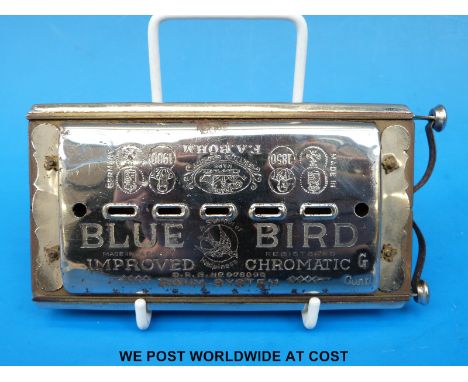 A double sided C/G chromatic Blue Bird harmonica by Bohm of Germany