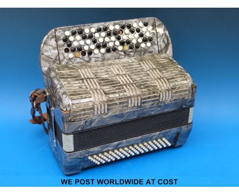 An 80 Bass Hohner Chromatic accordion in grey pearloid finish