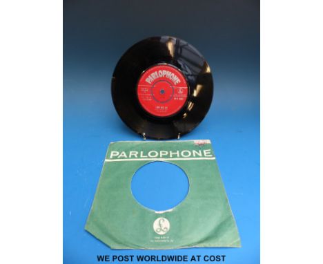 The Beatles “Love Me Do” (Parlophone 45-R 4949, first pressing, Red Label, matrix 7XCE 17144 1N).  The condition of the vinyl