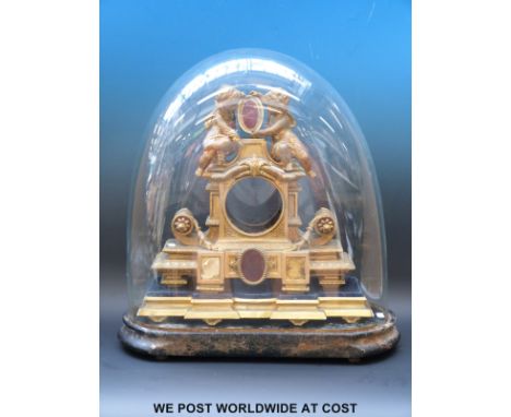 A French ormolu mantel clock on base with glass dome, no movement, putti decoration