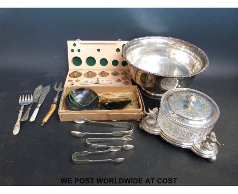 A Mappin & Webb silver plated bowl and a silver plated and glass covered bowl together with a travelling beam scale and a cas