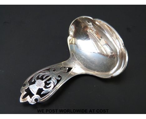 A Scottish hallmarked silver caddy spoon with pierced thistle design to handle, Edinburgh 1961 (20g)