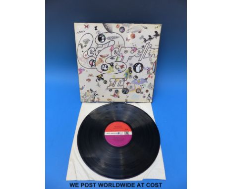 Led Zeppelin “III”.  UK first pressing with red/maroon label and “Peter Grant” credit, working wheel and excellent spine.   T