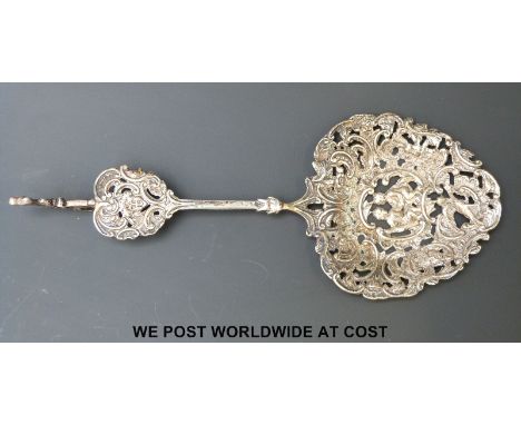 A Victorian hallmarked silver repoussé decorated and pierced sifter spoon with bird finial B/ham 1892 maker Nathan & Hayes le