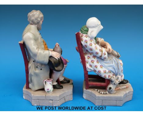 A pair of 19thC Russian porcelain figures, probably Gardner Manufactory, of a bearded gent petting his dog and sleeping lady 
