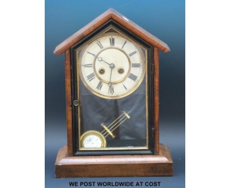 An American two train mantel clock with Roman numerals on painted dial and Brequet style hands, the movement striking on a go