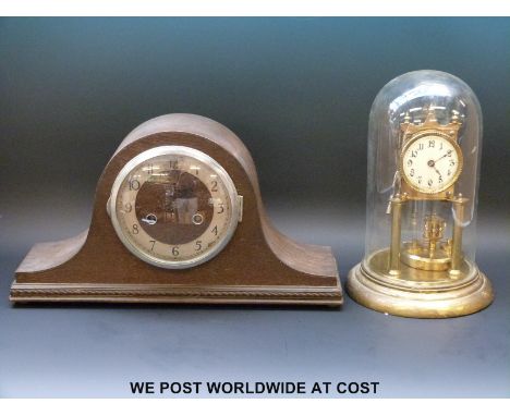 A brass Anniversary clock, ivory coloured dial, Arabic numerals, C1910, Urania to movement together with a 'Napoleon hat' man