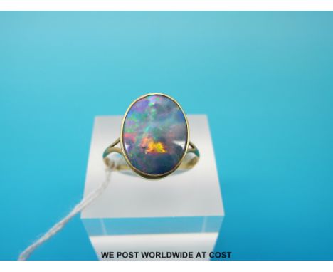 A yellow metal ring marked 18ct gold set with a doublet opal, (size P, 2.7g)  