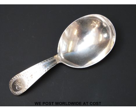 A Georgian hallmarked silver caddy spoon with bright cut handle, Ldn 1794 makers mark WS, length 9cm (8.7g)