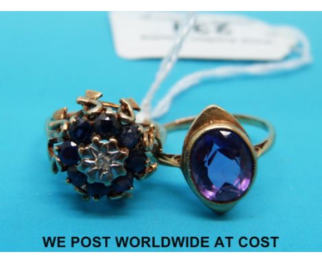 A 9ct gold ring set with a diamond surrounded by sapphires, and a yellow metal ring set with an amethyst 