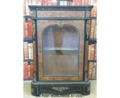 A 19thC Boulle work ebonised pier cabinet with ormolu mounts, surround, matching shaped top and base and velvet lined interio