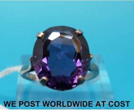 A silver ring set with a large oval amethyst (size O) 