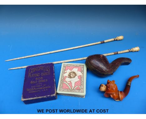 A cased Meerschaum pipe, playing cards and a pair of carved bone knitting needles, possibly Napoleonic prisoner of war