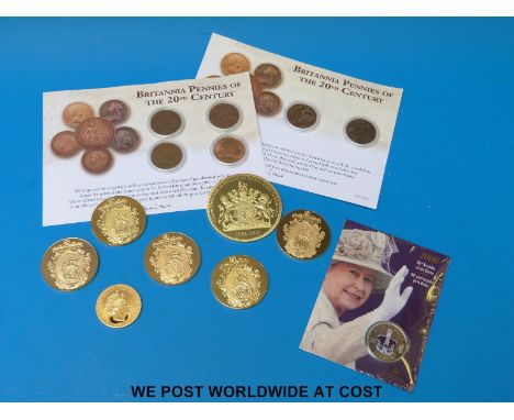 A small collection of various gold plated portrait commemorative medallion coins together with six cased 20thC Britannia penn