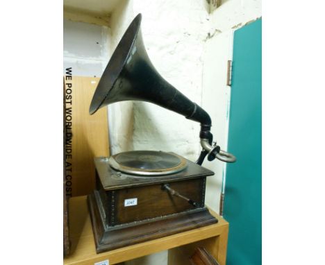 A vintage wind up gramophone with painted metal horn 