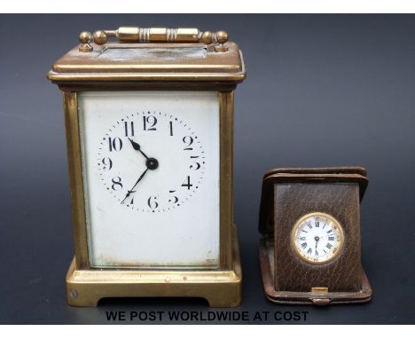 A small Gebruder Rodeck Wien travelling clock with Arabic numerals and a brass cased carriage clock