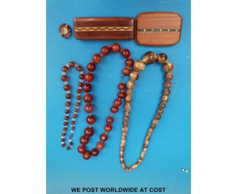 A graduated agate bead necklace, graduated turned horn necklace, agate compass fob and a retro inlaid vanity mirror and box